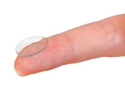 contact lens on finger close up isolated photo