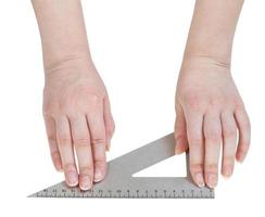 female hands with metallic triangle isolated photo