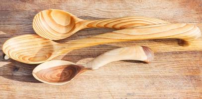 three carved wooden spoons photo