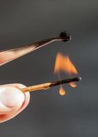 match flame ignites silk tissue sample photo