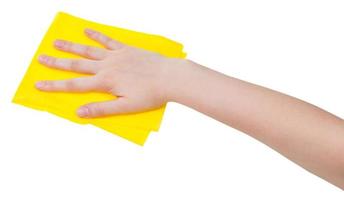 hand with yellow dusting rag isolated on white photo