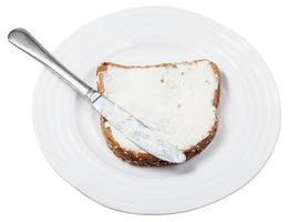 bread and soft Cheese sandwich with knife on plate photo