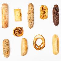 various freshly baked breads on white background photo