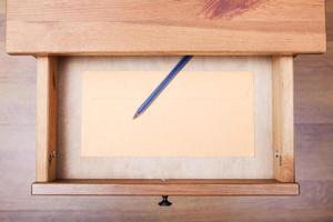 modern pen and envelope in open drawer photo