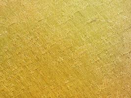 textile background - yellow colored silk fabric photo