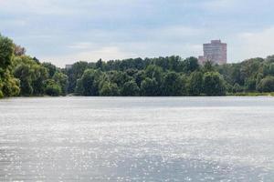 summer heavy rain on city pond photo