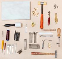 various leather craft instruments and marble board photo