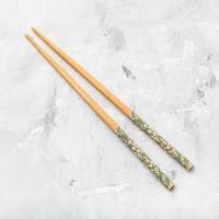 wooden chopsticks on concrete board photo