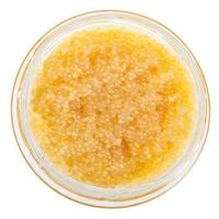 top view of glass jar with yellow caviar of pike photo