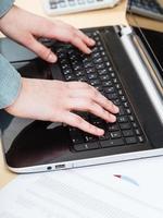 businessman working with laptop at office table photo