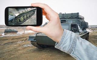 tourist taking photo of venicle in frozen tundra