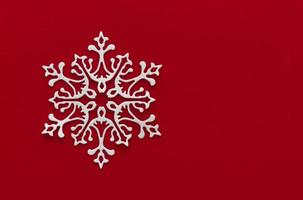 Snow red background. Background with snowflake, Christmas celebration concept. Flat lay photo