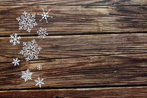 Snow wooden background. Background with snowflake, Christmas celebration concept. photo