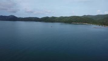 Beautiful sea waves and white sand beach in the tropical island. Ocean beach with soft waves and bright clouds in the sky on a hot summer day video