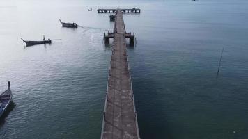 Aerial view from a drone of a pier in a tropical sea. video