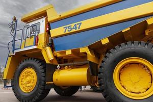 Minsk, Belarus, September 20, 2022- Yellow mining dump truck Belaz with a carrying capacity of twenty tons. photo