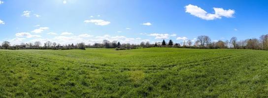 Beautiful high resolution panorama of a northern european country landscape with fields and green grass photo