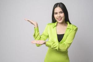 Portrait of beautiful woman over white background studio. photo