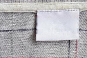 laundry care clothing label on fabric texture photo