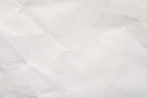 Abstract white crumpled paper texture background photo