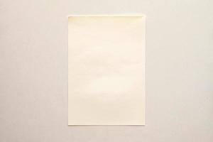blank note paper on white wall photo