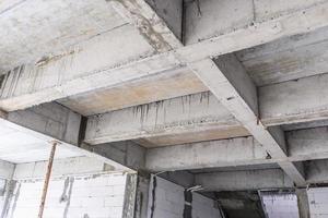 Concrete beam structure at house building construction site photo