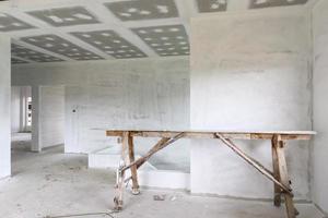 Empty room interior with gypsum board ceiling at construction site photo