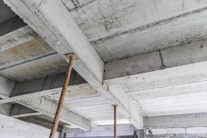 building under construction with iron steel support concrete beams photo