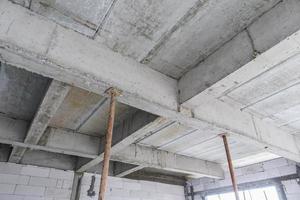 building under construction with iron steel support concrete beams photo