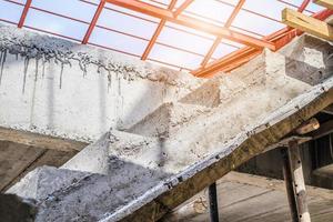 New house construction with concrete staircase at building site photo