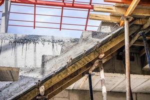 New house construction with concrete staircase at building site photo