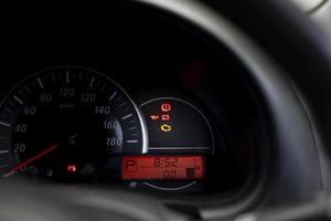 The dashboard shows the status of the car's light that is on. photo
