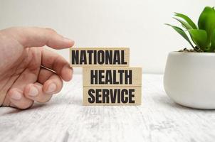 Text NHS National Health Service on a white background. photo