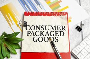 Text CPG - Consumer Packaged Goods text written on paper folder and charts photo