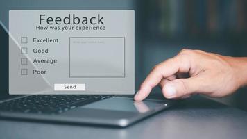 Customers respond to surveys and opinions through laptops, Customer service and Satisfaction , submitting assessment data or suggestions from using online services,feedback concept photo