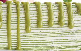 Close up of the layer of Matcha green tea crepe cake one of the famous sweet dessert. photo