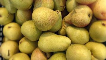 Yellow background with fresh pears. photo
