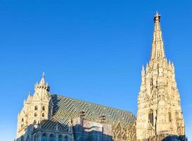 towers of St. Stephen cathedral and blue sky photo