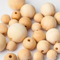 many natural wooden balls on white photo