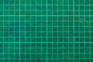 green self-healing cutting mat close up photo