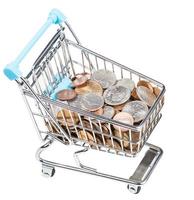 shopping trolley with US coins isolated photo