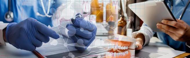 Medicine doctor hand working on a patients x-ray scans digital healthcare and connection with modern virtual screen interface icons, Medical technology and network concept. photo