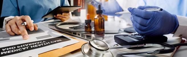 Medicine doctor hand working on a patients x-ray scans digital healthcare and connection with modern virtual screen interface icons, Medical technology and network concept. photo