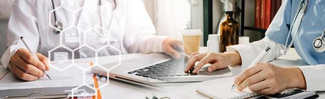 Medicine doctor hand working on a patients x-ray scans digital healthcare and connection with modern virtual screen interface icons, Medical technology and network concept. photo