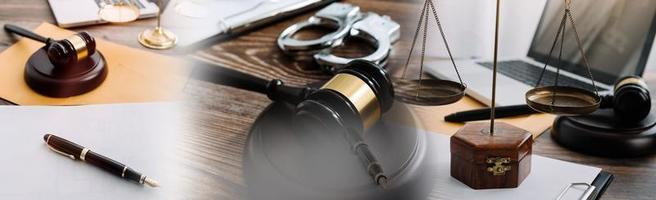Justice and law concept.Male judge in a courtroom with the gavel, working with, computer and docking keyboard, eyeglasses, on table in morning light photo