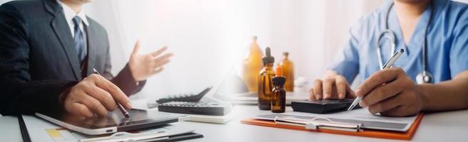 Medicine doctor hand working on a patients x-ray scans digital healthcare and connection with modern virtual screen interface icons, Medical technology and network concept. photo