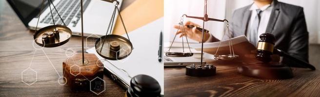 Justice and law concept.Male judge in a courtroom with the gavel, working with, computer and docking keyboard, eyeglasses, on table in morning light photo