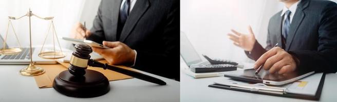 Justice and law concept.Male judge in a courtroom with the gavel, working with, computer and docking keyboard, eyeglasses, on table in morning light photo