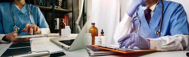 Medicine doctor hand working on a patients x-ray scans digital healthcare and connection with modern virtual screen interface icons, Medical technology and network concept. photo