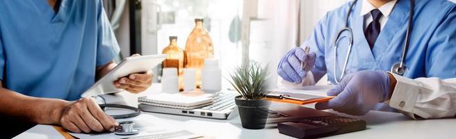 Medicine doctor hand working on a patients x-ray scans digital healthcare and connection with modern virtual screen interface icons, Medical technology and network concept. photo